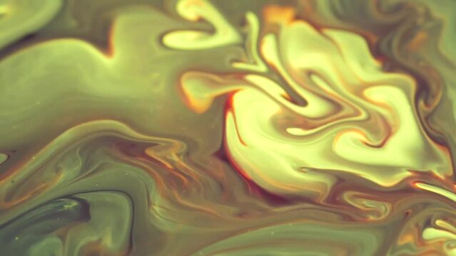 Closeup of colorful ink floating on the water surface