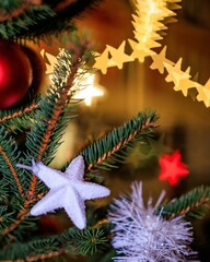 Vibrant Christmas tree adorned with festive decorations, illuminated by a string of twinkling lights