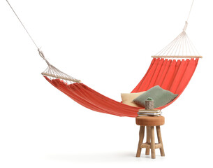 Cozy red hammock with cushions and books with houseplant on soft stool against white background