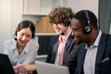 Young and diverse group. multi-ethnic female colleagues Customer Services Agent Working In A Call Center. Young multi-ethnic group of professionals. Business team concept. Young.