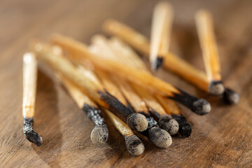 Matchsticks burned on the wooden bottom.