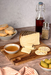 Food photography of french cheese, cracker; toast, bread, honey, olive, seasoning, slice, gourmet, dairy, delicatessen, soft, fat