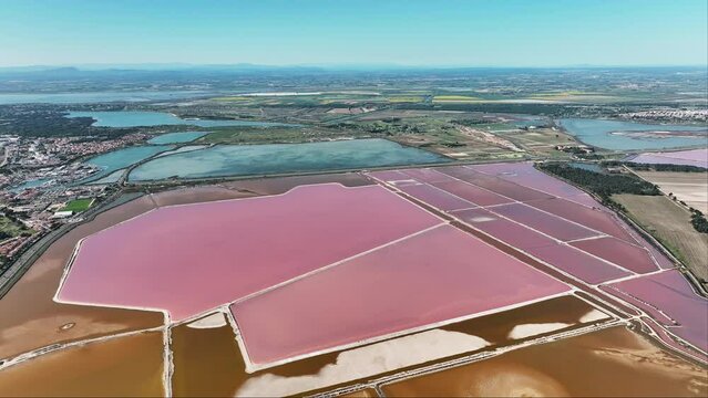 A breathtaking aerial of the roseate salt fields of Aigues-Mortes.
