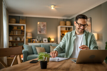 one man adult caucasian work on laptop at home happy smile