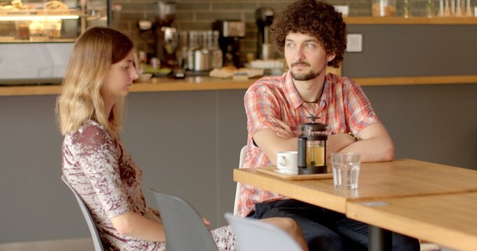 Guy talking with girl, understanding nods. Facial features shape of mustache and beard, reflect unique personality and style. Carefully groom facial hair to enhance overall look. Human self-expression