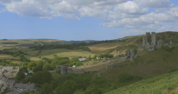Aerial panoramic static view Corfe Castle - Dorset, Purbeck Hills, England. Tourist visit Corfu castle sightseeing England on summer vacation