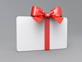 Blank 3d white gift card or gift voucher with red ribbon bow isolated on grey background with shadow minimal conceptual 3D rendering