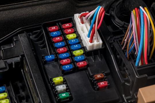 Fuse panel under the hood of vehicle. Automobile electrical repair, service and maintenance concept