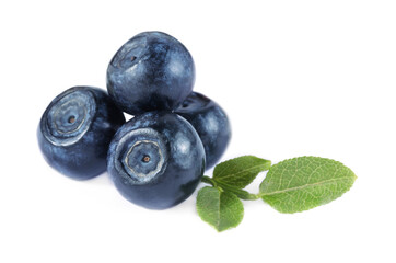 Delicious ripe bilberries and green leaves isolated on white