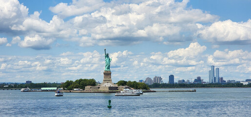 Statue of Liberty over the Scene of New york cityscape river side. Architecture and building. touristic landmark of New York City. Liberty statue in New York city with manhatttan. statue of liberty © be free