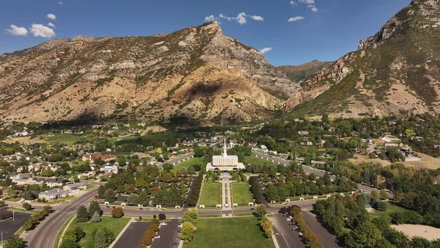 Aerial Provo Utah LDS temple mountain valley forward 2. Temple of The Church of Jesus Christ of Latter-day Saints, LDS or Mormon religion. Christian religious groups. Sacred for eternal worship.