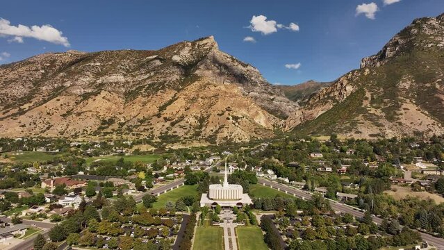 Aerial Provo Utah LDS temple mountain valley pull 1. Temple of The Church of Jesus Christ of Latter-day Saints, LDS or Mormon religion. Christian religious groups. Sacred for eternal worship.