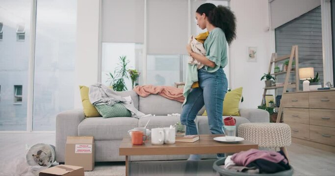 Cleaning, living room and woman at home with maid work and housekeeping maintenance. Cleaner, laundry and clothing for washing in a house with job in a lounge at morning with helping from worker