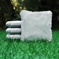 3d rendering illustration of a stack of cornhole bags on grass background selective focus - 650945564