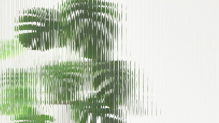 Fresh beautiful green tropical giant monstera behind transparent reeded glass in sunlight with copy...