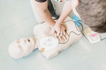 First aid cardiopulmonary resuscitation course using automated external defibrillator device, AED. - 650952368