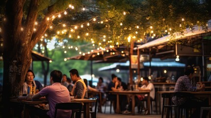 Obraz na płótnie Canvas Bokeh Background of Asia's Restaurant Scene, where People Savor Meals, Socialize, and Enjoy Live Music
