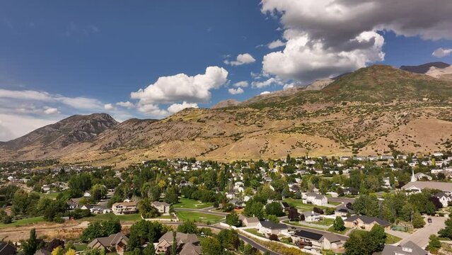 Aerial Lindon Utah neighborhood homes mountain. Lindon in Utah County, Utah. Part of the Provo Orem, Utah Metropolitan Area. Summer season in Wasatch Mountain range valley. Residential homes.