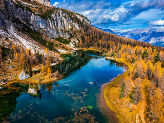 Autumn colors on Lake Federa. Dolomites from above - 650973733