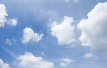blue sky background with white clouds.