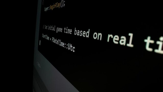 Closeup macro shot movement of coding script moving across LED screen with real-time AI-generated typing, showcasing advanced AI learning in optimization, debug and coding for software development.