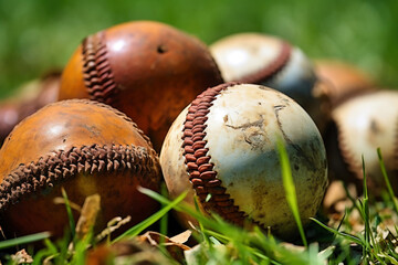 Photo of a pile of baseballs on green grass