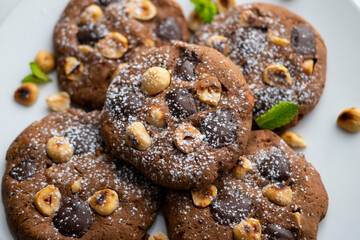 Homemade chocolate cookies with hazelnut pieces.