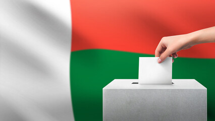 Woman puts ballot paper in voting box on Madagascar flag background. Election concept. - obrazy, fototapety, plakaty
