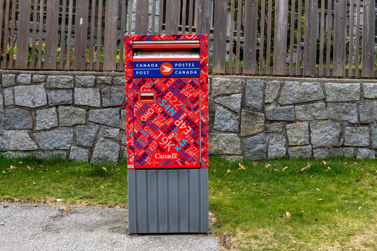 Vancouver, BC, Canada - 5 April 2023. Canada Post Letter Box decorated with postal codes. Postes Canada mailbox
