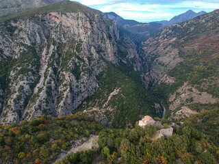 Amazing view over ridomo gorge in mountainous Mani area. At bottom rignt Prophet Helias traditional christian chapel in Mani, Messenia, Peloponnese, Greece