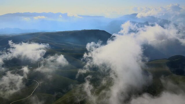 Flying through the clouds and over mountains