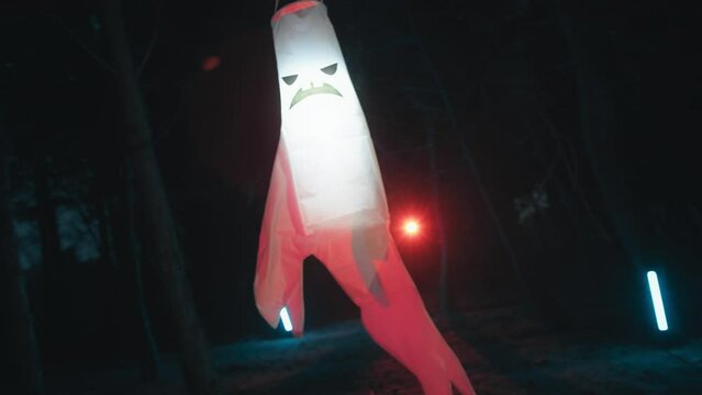 Glowing flashing ghost in the night halloween forest