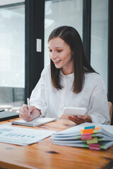 Business woman using business paper for doing math finance on office desk, tax, report, accounting, statistics, and analytical research concept