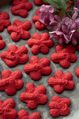 traditional Chinese New Year red sand cookie, symbolizing luck and happiness. cookies are baked during Chinese New Year celebration. captures intricate details of festive, representing good fortune