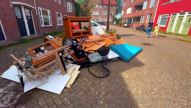 Bulky waste and junk lie on the street in a working class neighborhood