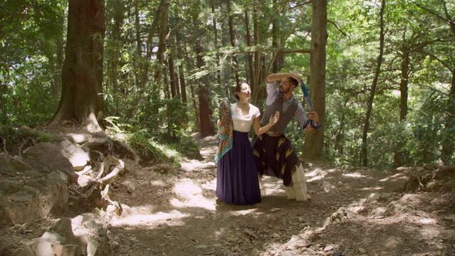 Woman and Man Dancing Chacarera Together in a Forest, Beautiful Dappled Light, Trees, Sensual, Traditional, Slow Motion 