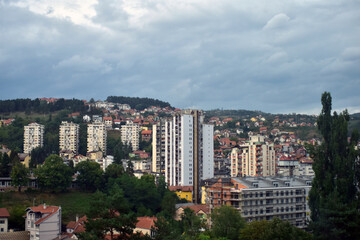 Fototapeta premium Panorama of city of Uzice, Serbia. Town scene with apartment buildings and houses.