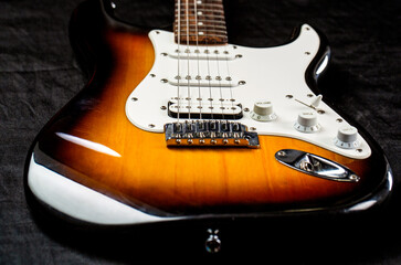 Stringed electric musical instrument. Musical instrument for rock, blues, metal songs. Guitar strings, close up. Electric Bass Guitars. Electric guitar. Close up of music guitar
