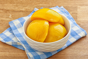 Sweet canned peaches with syrope