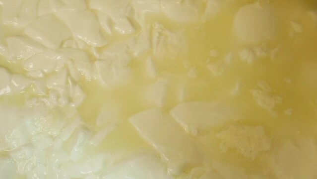 close up of cheese making 