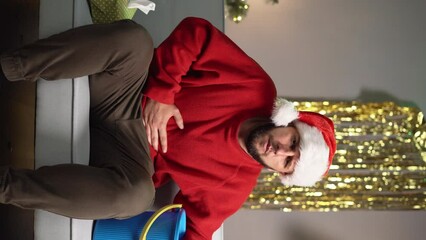 A man suffering from nausea and vomiting after a Christmas party. Food and alcohol poisoning