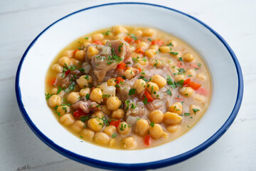 Stewed chickpeas with pig's feet. Traditional recipe from northern Spain.