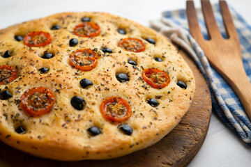Italian foccaccia with black olives and cherry tomatoes.