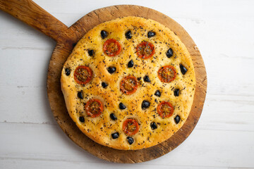 Italian foccaccia with black olives and cherry tomatoes.