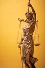 Themis and gavel in court library