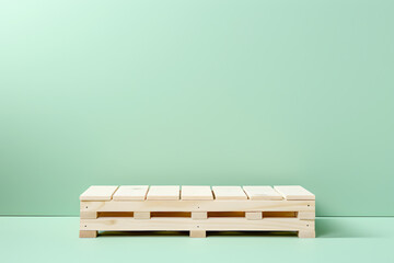 Wooden pallet podium in front of pastel green shade wall, pistachio color. Minimalist creative...