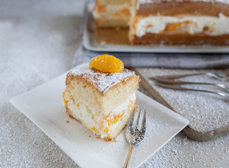 Tangerine cream cake on a plate