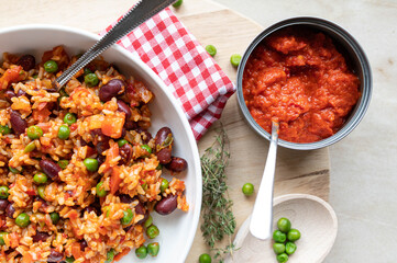 Ajvar relish with brown rice, vegetables peas and beans. Balkans food