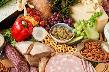 Table full of mediterranean appetizers, tapas or antipasto. Assorted Italian food set. Delicious snack on party or picnic time. Meat and cheese. Italian style banquet. 