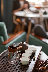 Brewing white tea in a transparent teapot. Everything is ready for the tea ceremony. The ceremony is according to all the rules, but not in the classical style. Adapted to a modern apartment.